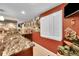 Close-up view of the finished basement bar with wine cooler, granite counters, and shelving at 25262 E 2Nd Pl, Aurora, CO 80018
