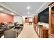 Finished basement with home theater, pool table, wet bar, and entertainment amenities at 25262 E 2Nd Pl, Aurora, CO 80018