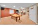 Spacious finished basement with a pool table, bar, and entertainment area at 25262 E 2Nd Pl, Aurora, CO 80018