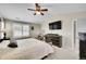 Bright bedroom featuring a ceiling fan and a dedicated workspace at 25262 E 2Nd Pl, Aurora, CO 80018