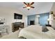 Spacious bedroom featuring a ceiling fan and a dedicated workspace at 25262 E 2Nd Pl, Aurora, CO 80018