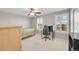 Sunlit bedroom featuring a ceiling fan, and neutral walls at 25262 E 2Nd Pl, Aurora, CO 80018
