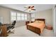 Bright bedroom featuring a ceiling fan, natural light, and neutral walls at 25262 E 2Nd Pl, Aurora, CO 80018