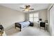 Clean bedroom with large window and dedicated desk area at 25262 E 2Nd Pl, Aurora, CO 80018