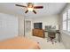 Cozy bedroom with a ceiling fan and dedicated desk area at 25262 E 2Nd Pl, Aurora, CO 80018