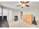 Bright bedroom featuring a ceiling fan, and neutral walls at 25262 E 2Nd Pl, Aurora, CO 80018