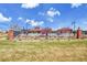 The community pool features a fence, landscaping and common structures for residents at 25262 E 2Nd Pl, Aurora, CO 80018