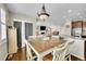 Inviting dining area with hardwood floors, a stylish light fixture, and ample natural light at 25262 E 2Nd Pl, Aurora, CO 80018