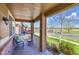 Relaxing covered front porch with seating and a view of the street at 25262 E 2Nd Pl, Aurora, CO 80018
