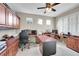 Dedicated home office space with custom built-ins, dual workstations, and natural light at 25262 E 2Nd Pl, Aurora, CO 80018