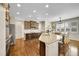 Bright kitchen with granite countertops, stainless steel appliances, and an island with bar seating at 25262 E 2Nd Pl, Aurora, CO 80018