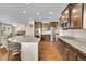 Well-equipped kitchen with stainless steel appliances, granite countertops, and dark wood cabinets at 25262 E 2Nd Pl, Aurora, CO 80018