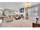 Comfortable living room with a fireplace, large windows, and stylish furnishings at 25262 E 2Nd Pl, Aurora, CO 80018