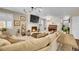 Cozy living room featuring a fireplace, large screen TV, neutral color palette and plush seating at 25262 E 2Nd Pl, Aurora, CO 80018
