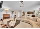 Spacious living room with an open layout, seamlessly connecting to the kitchen and dining area at 25262 E 2Nd Pl, Aurora, CO 80018