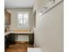 Cozy office nook with built-in desk, natural light and hardwood floors at 25262 E 2Nd Pl, Aurora, CO 80018