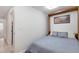 Serene bedroom with a cozy bed, showcasing a simple yet inviting space with ample natural light at 7134 Kiowa Rd, Larkspur, CO 80118
