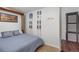 Inviting bedroom with ski decor and a comfortable bed offering a cozy and unique living space at 7134 Kiowa Rd, Larkspur, CO 80118