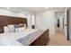 This bedroom features a dark wood frame bed, carpeted floors, and neutral walls at 7134 Kiowa Rd, Larkspur, CO 80118