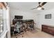 This home office/bedroom features a ceiling fan and a large window providing ample natural light at 7134 Kiowa Rd, Larkspur, CO 80118