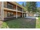 A beautiful two-story home with a large covered porch and manicured lawn with lovely flowers at 7134 Kiowa Rd, Larkspur, CO 80118
