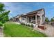 Backyard featuring a covered patio, manicured lawn and rock features at 22583 E Union Cir, Aurora, CO 80015