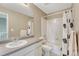 Bathroom featuring white fixtures, a shower-tub combo, and a neutral-toned vanity at 22583 E Union Cir, Aurora, CO 80015