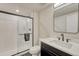 Modern bathroom with black fixtures, a glass-enclosed shower, and a sleek vanity with a white countertop at 22583 E Union Cir, Aurora, CO 80015