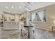 Bright dining area featuring a modern chandelier and a view through a large window at 22583 E Union Cir, Aurora, CO 80015