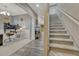 Open-concept entryway showing staircase, wood floors, and a home office with ample natural light, creating an inviting atmosphere at 22583 E Union Cir, Aurora, CO 80015