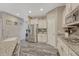 Well-equipped kitchen features granite counters, stainless steel appliances, gray wood floors, and ample cabinet space at 22583 E Union Cir, Aurora, CO 80015