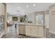 Open-concept kitchen featuring a large island, stainless steel appliances, and seamless flow into the dining and living areas at 22583 E Union Cir, Aurora, CO 80015