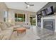 Cozy living room with a fireplace, backyard access, and lots of natural light at 22583 E Union Cir, Aurora, CO 80015