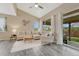 Bright living room with vaulted ceiling, and sliding glass doors to the backyard at 22583 E Union Cir, Aurora, CO 80015