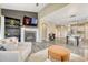 Open concept living space with fireplace and adjacent dining and kitchen areas at 22583 E Union Cir, Aurora, CO 80015