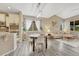 Open-concept living space with vaulted ceiling, adjacent to modern kitchen and dining at 22583 E Union Cir, Aurora, CO 80015
