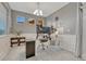 Well-lit home office with modern desk setup, wainscoting, ample natural light, and neutral colors for a productive workspace at 22583 E Union Cir, Aurora, CO 80015