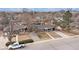 A cozy single-story home with a driveway, complemented by lush trees in a peaceful neighborhood setting at 3149 Wheeling St, Aurora, CO 80011