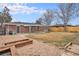 A backyard with a grassy lawn and a garden bed, offering outdoor space at 3149 Wheeling St, Aurora, CO 80011