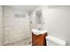 Updated bathroom with a tiled shower and modern fixtures at 3149 Wheeling St, Aurora, CO 80011