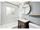 Modern bathroom featuring subway tile, a tub, and a stylish vanity at 3149 Wheeling St, Aurora, CO 80011