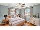 Light-filled bedroom with hardwood floors and two windows at 3149 Wheeling St, Aurora, CO 80011