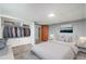 Bedroom with closet space, neutral color scheme, and minimalist decor at 3149 Wheeling St, Aurora, CO 80011