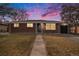 Charming brick home with a well-maintained lawn and a welcoming walkway to the front door at 3149 Wheeling St, Aurora, CO 80011