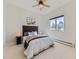 Bedroom featuring a large window, a bed with throw pillows, and two side tables with lamps at 8390 E Summit Rd, Parker, CO 80138