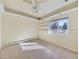 Cozy bedroom with a ceiling fan, bright window, neutral walls, and shelving at 8390 E Summit Rd, Parker, CO 80138