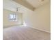 Spacious bedroom featuring plush carpeting, natural light from a large window, and neutral walls at 8390 E Summit Rd, Parker, CO 80138