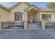 Close up of the front entrance featuring a decorative front door, stone pillars, and large windows at 8390 E Summit Rd, Parker, CO 80138