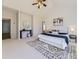 Spacious main bedroom featuring a vaulted ceiling, a ceiling fan, a large window and neutral decor at 8390 E Summit Rd, Parker, CO 80138