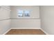 Unfinished basement storage room with shelving and a window at 446 Dione Pl, Lone Tree, CO 80124